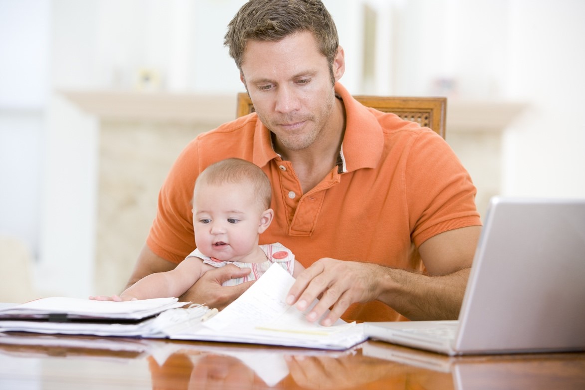 Man with baby works from home